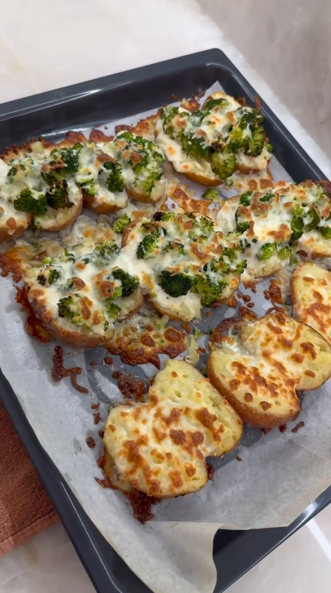 Baked potatoes w/ broccoli + cheese